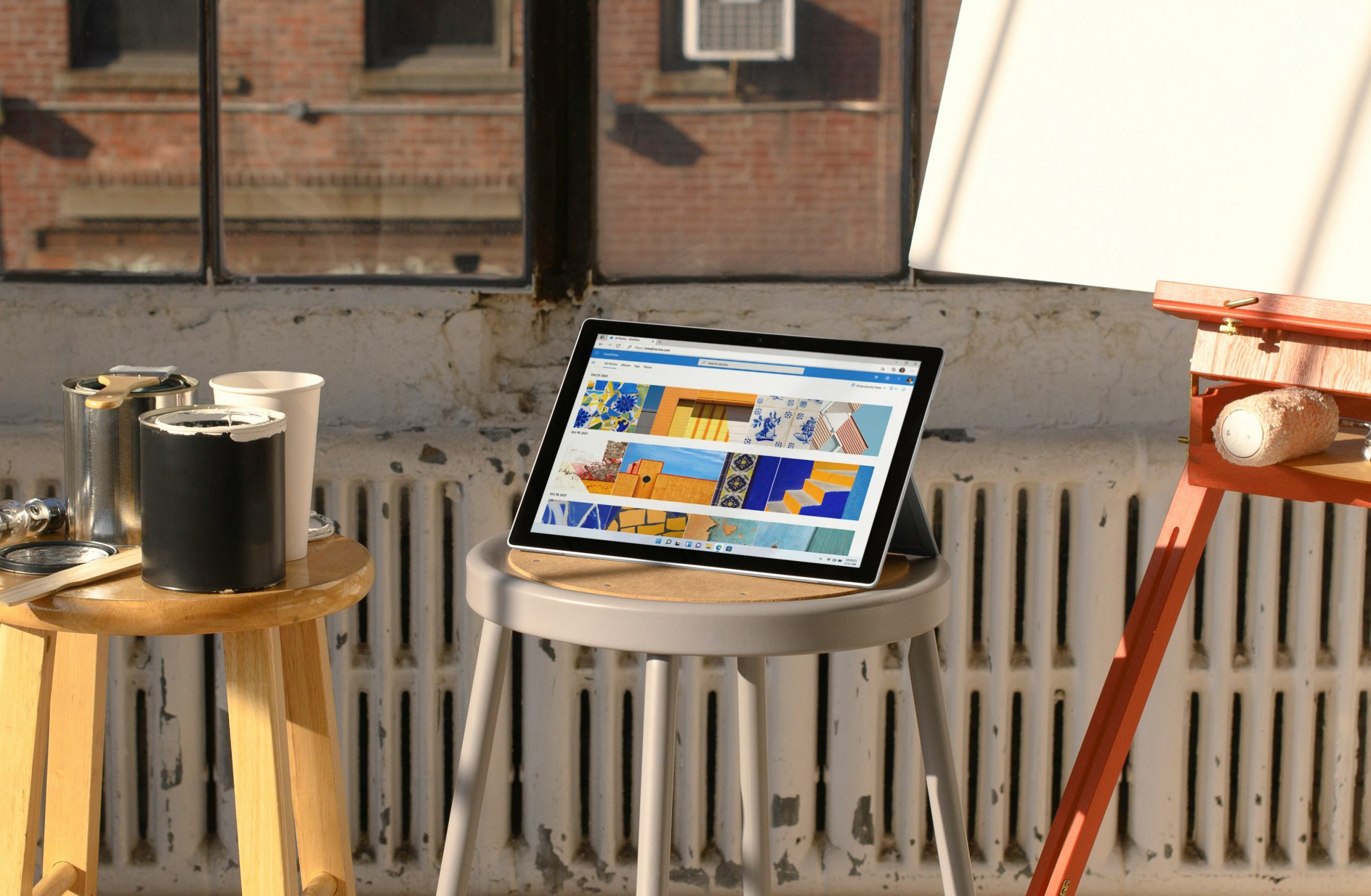 Laptop displaying an ecommerce website with a shopping cart and credit card on the table