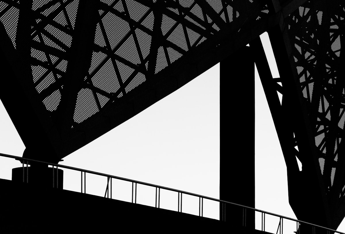 Abstract view of a bridge's steel structure.