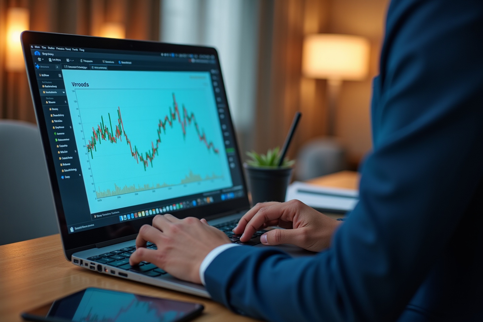 Homme d'affaires analysant des graphiques financiers sur un ordinateur portable.